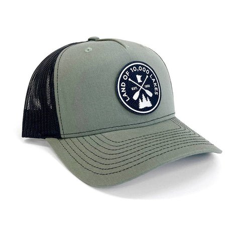 Green and black cap with a Land of 10.000 lakes logo.