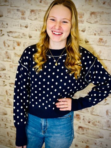 navy blue sweater with white snowflakes
