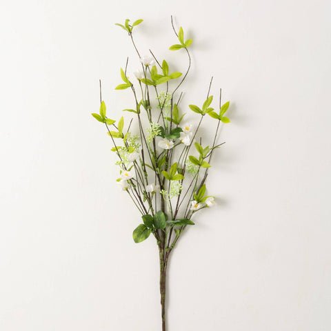 this spray is lush spring green leaves with a dappling of white flowers